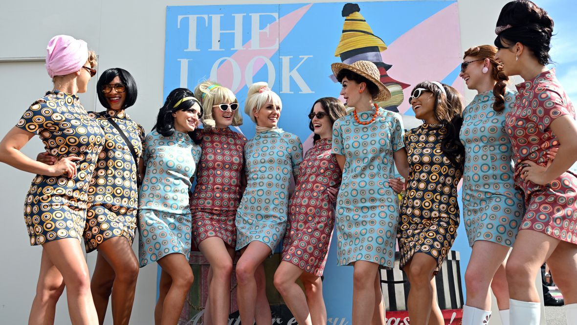 Visitors at Goodwood Revival in period style